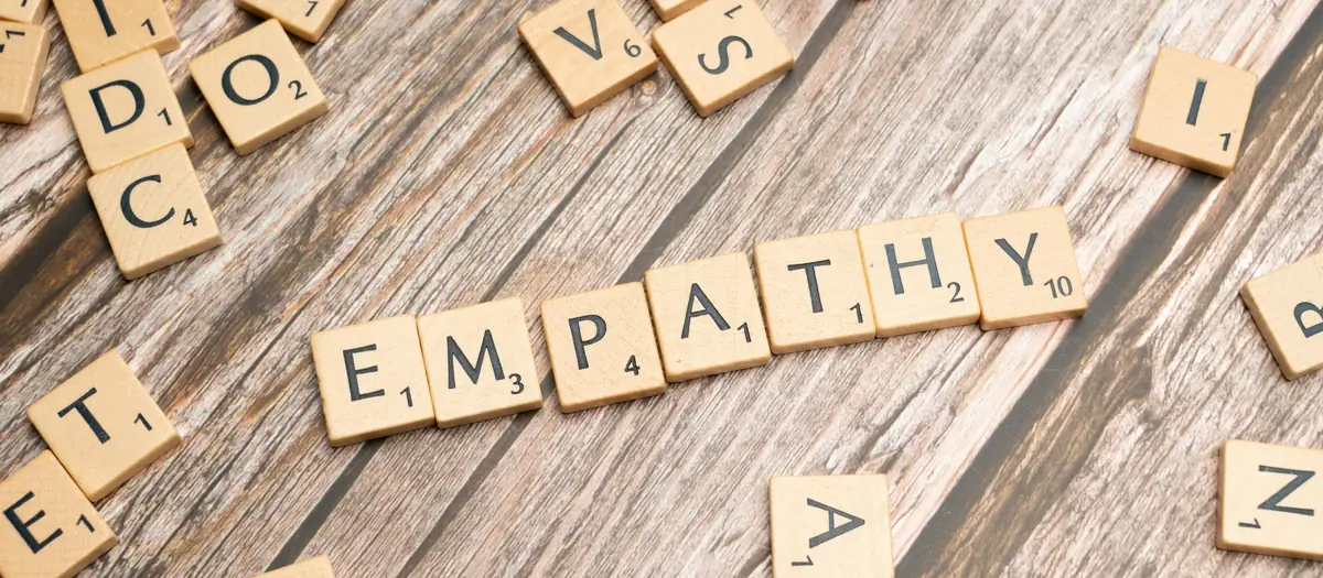 Wooden letter tiles spelling the word empathy
